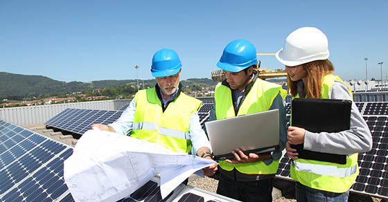 Group of engineers meeting on building roof