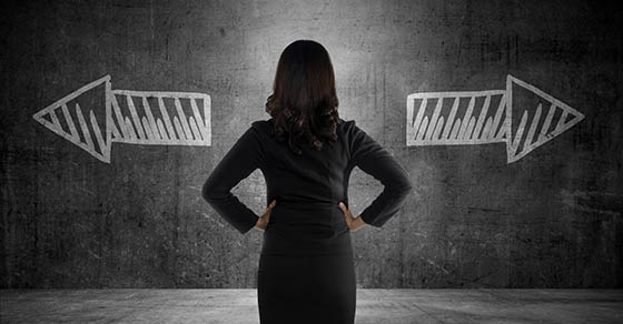 Business woman has to choose between two way. Business option conceptual