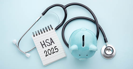 Health saving account, hsa concept, piggy bank with stethoscope on pastel blue background, top view