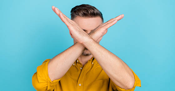 Photo of confident mature guy close his face crossed arms palms dont see discrimination isolated over blue color background