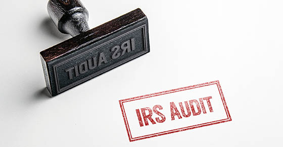Rubber stamping that says 'IRS Audit'.