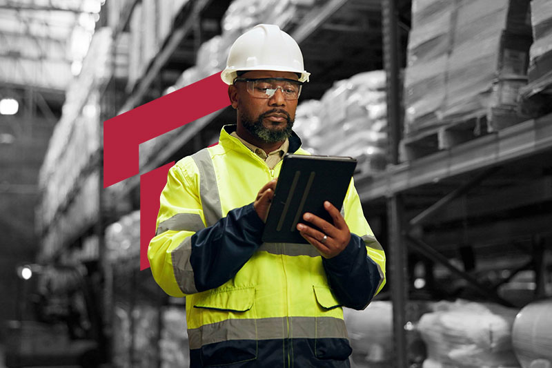 Manufacturing plant manager reviewing accounting data